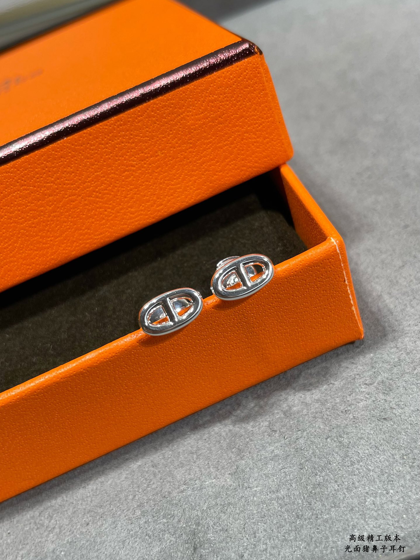 H**mes pig nose stud earrings