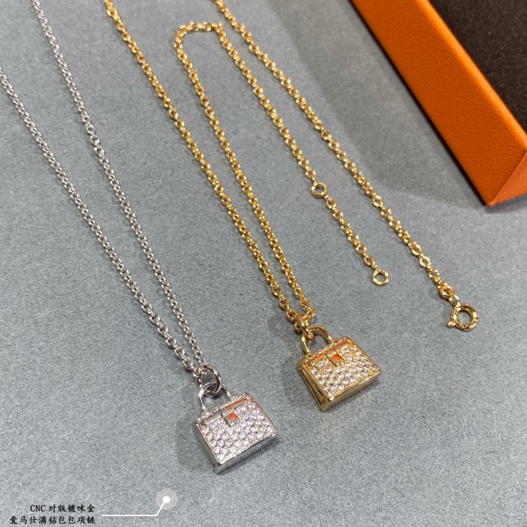 H**mes fully di*m*nd-encrusted bag necklace