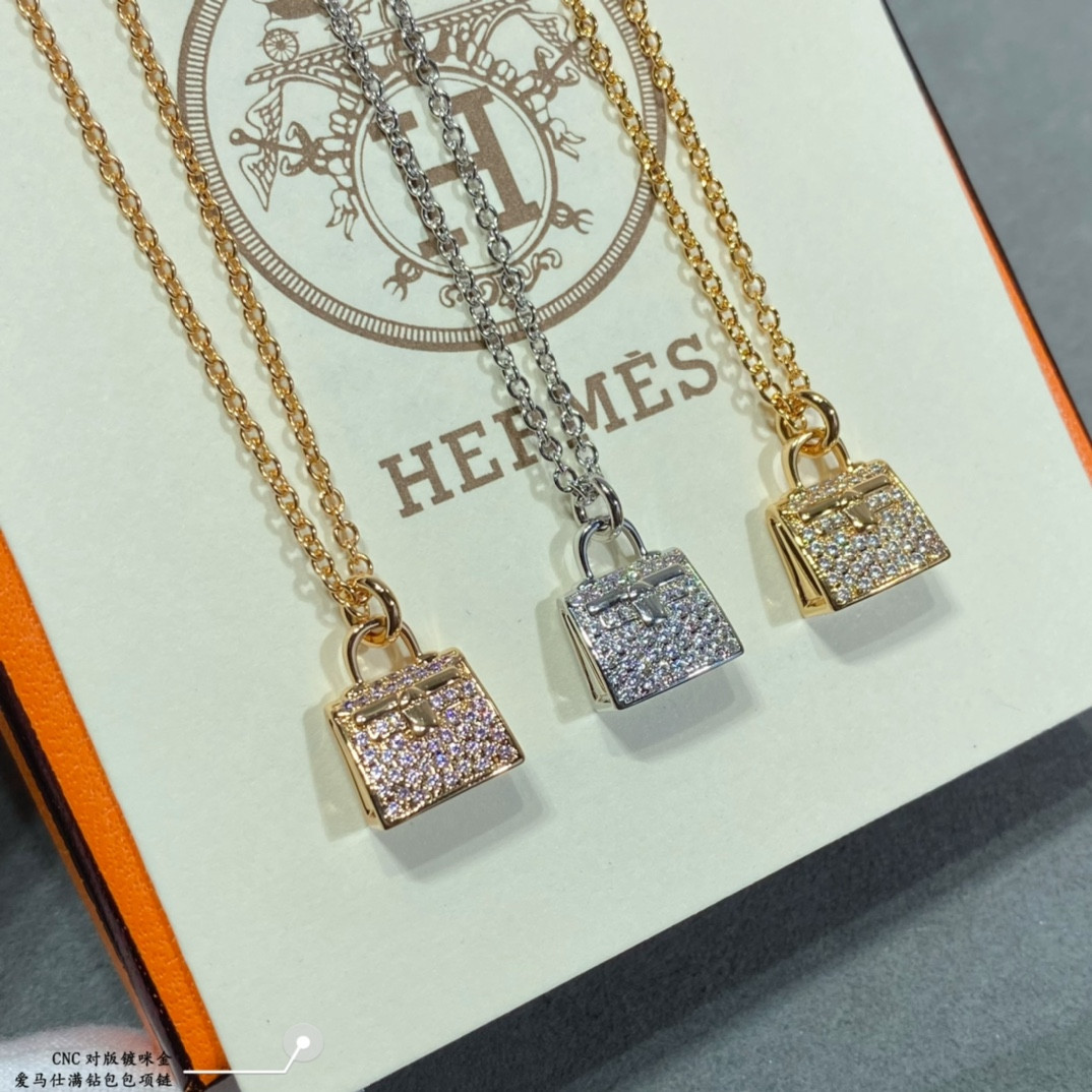H**mes fully di*m*nd-encrusted bag necklace