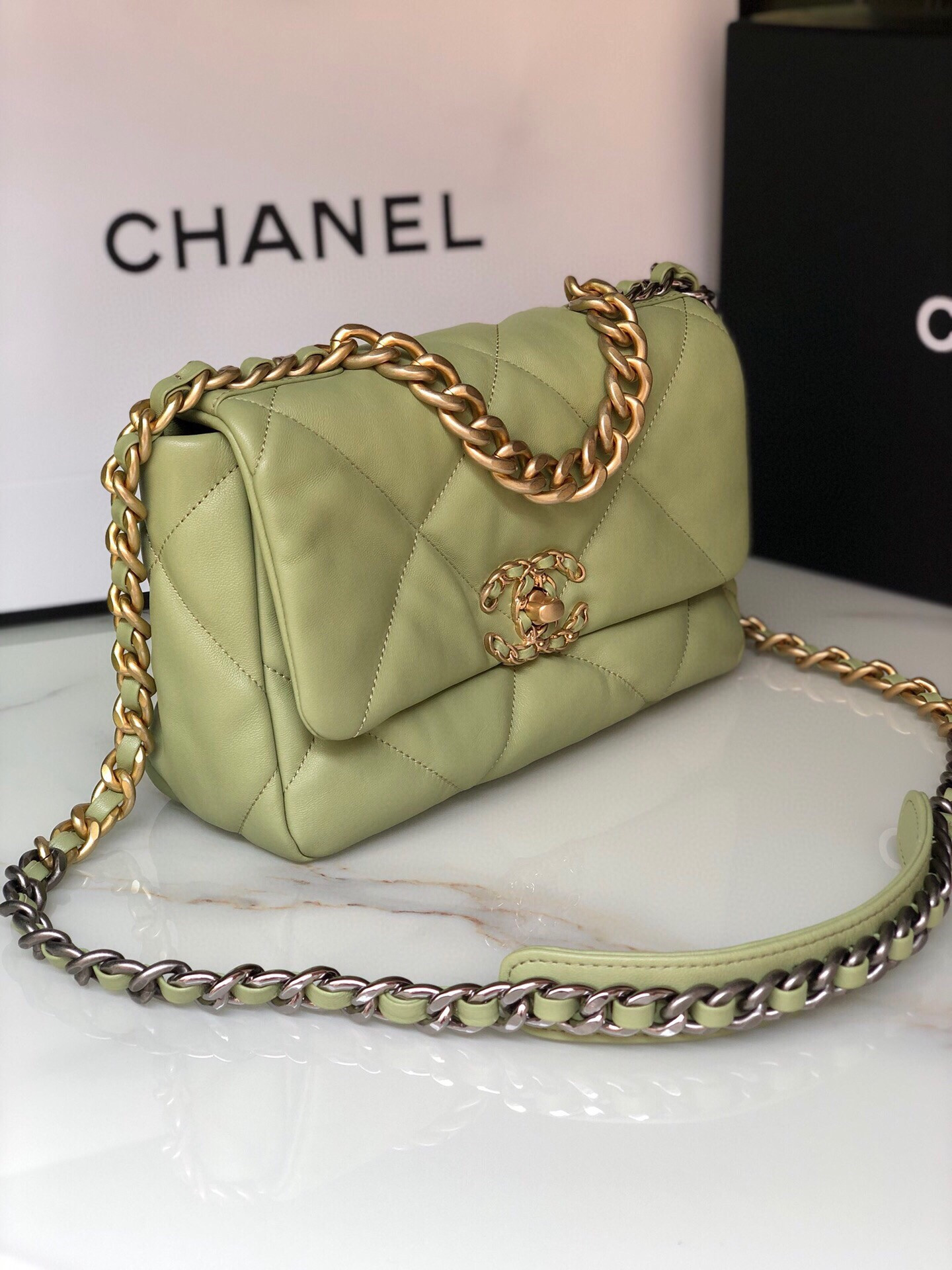 Ch*el 19 handbag shiny leather, gold-tone, silver-tone & ruthenium-finish metal light green 6.2 × 10.1 × 3.5 in