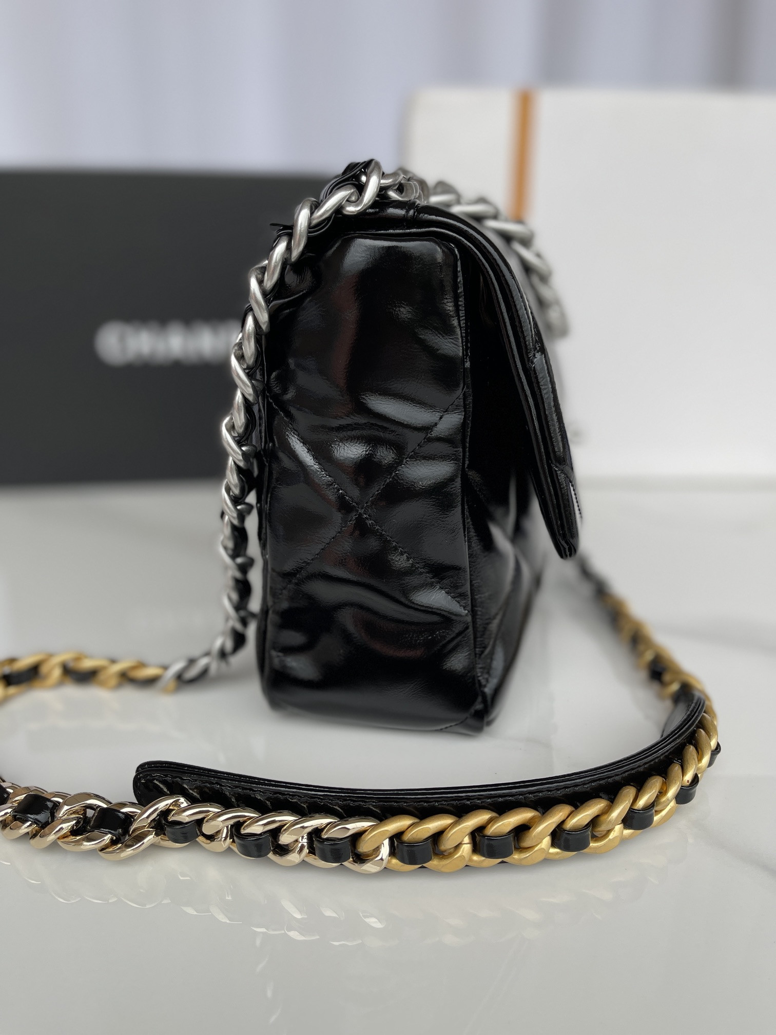 Ch*el 19 large handbag shiny leather, gold-tone, silver-tone & ruthenium-finish metal black 7.8 × 11.7 × 3.9 in