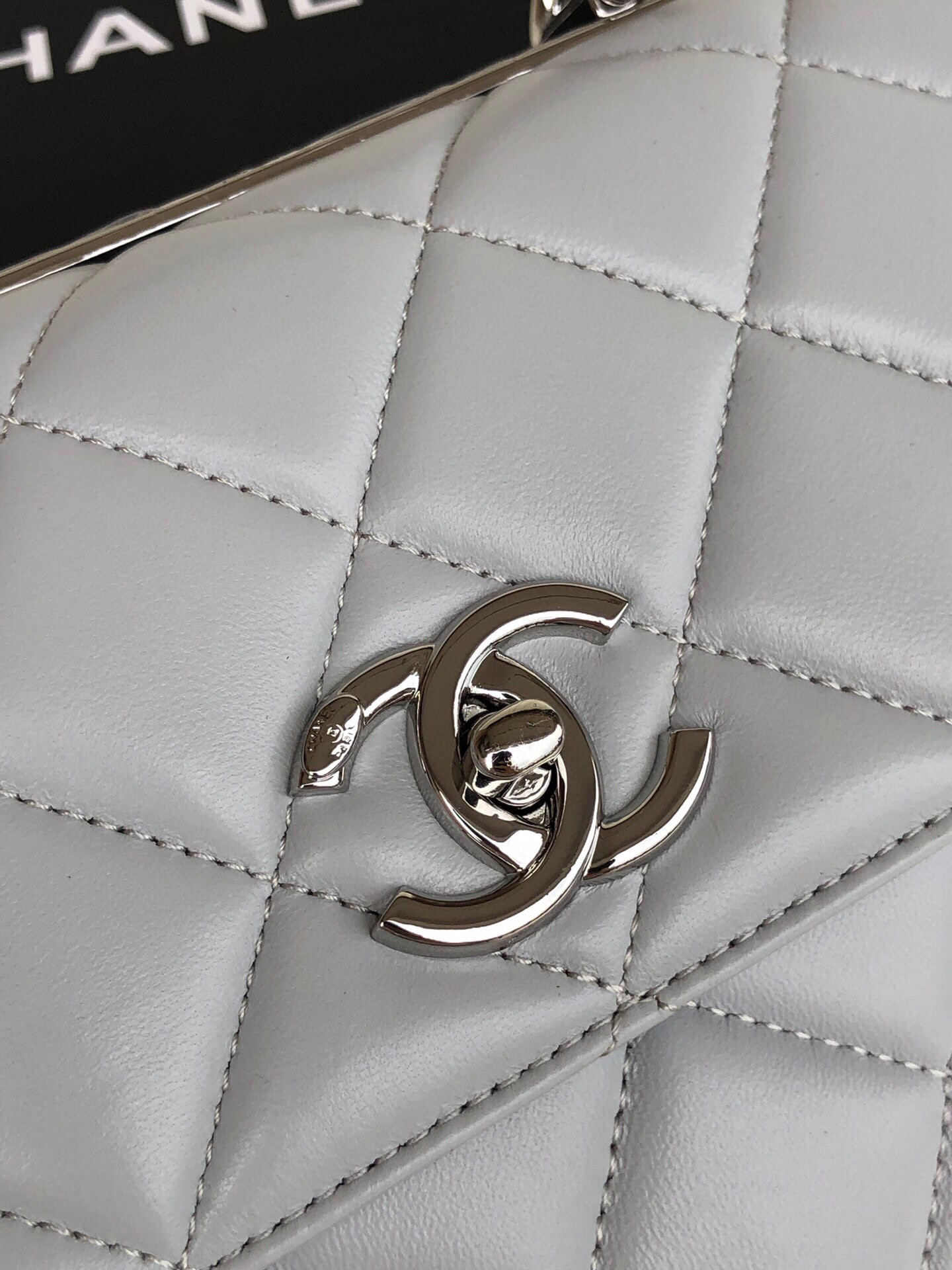 Ch*el flap bag with top handle 6.6 × 9.8 × 4.7 in